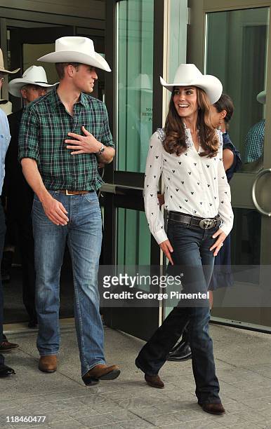 Prince William, Duke of Cambridge and Catherine, Duchess of Cambridge watch traditional Calgary Stampede activities at the BMO Centre on July 7, 2011...