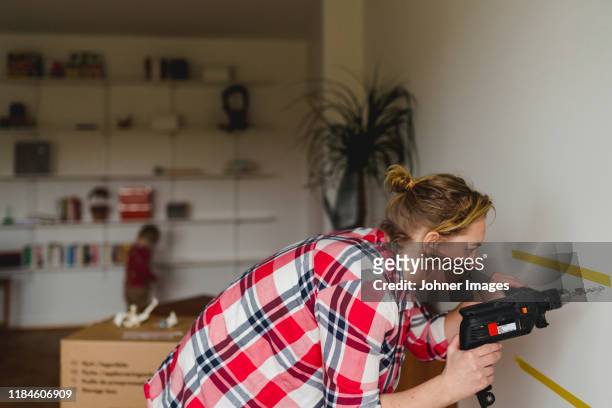 woman with electric drill - woman diy stock pictures, royalty-free photos & images