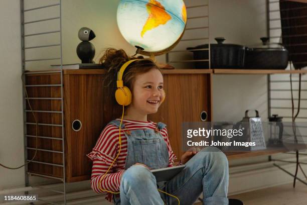 girl using digital tablet - three quarter length stockfoto's en -beelden