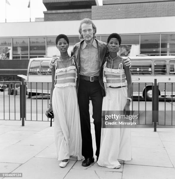 Ginger Baker, Drummer and founder of the rock band Cream, pictured with the Lijadu Sisters, Taiwo and Kehinde Lijadu, identical twin sisters aged 21...