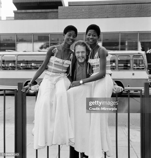 Ginger Baker, Drummer and founder of the rock band Cream, pictured with the Lijadu Sisters, Taiwo and Kehinde Lijadu, identical twin sisters aged 21...