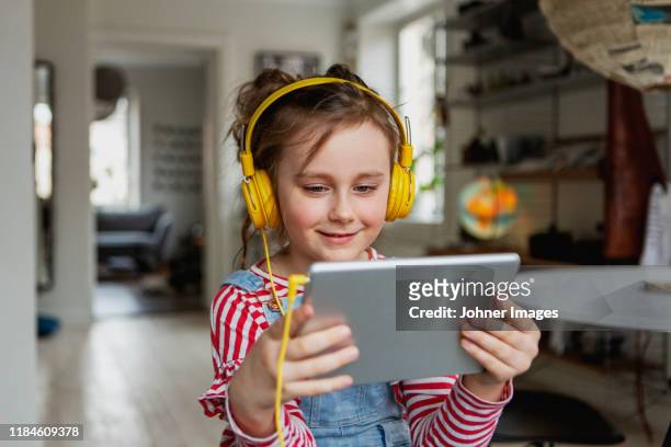 girl using digital tablet - tablet stockfoto's en -beelden
