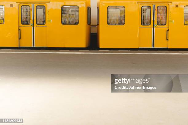yellow subway train - berlin subway stock pictures, royalty-free photos & images