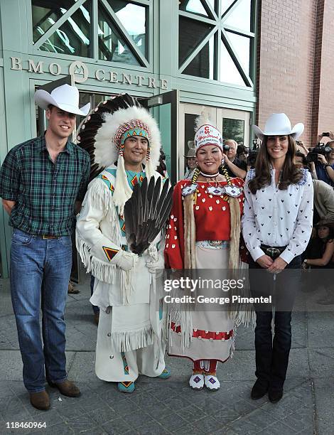 Prince William, Duke of Cambridge and Catherine, Duchess of Cambridge watch traditional Calgary Stampede activities at the BMO Centre on July 7, 2011...