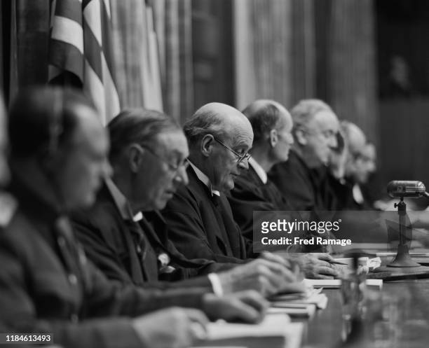 Lord Justice Geoffrey Lawrence , the British judge presiding at the Nuremberg Trials, reads part of the verdict against leading Nazi figures for war...