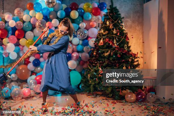 dancing and cleaning after party - messy house after party stock pictures, royalty-free photos & images