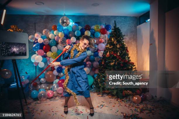 dancing and cleaning after new year party - clean up after party stock pictures, royalty-free photos & images