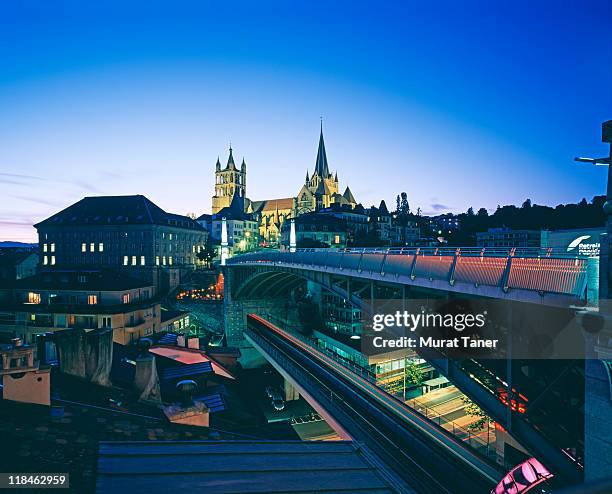 bridge and cathedral at dusk - lausanne stock-fotos und bilder