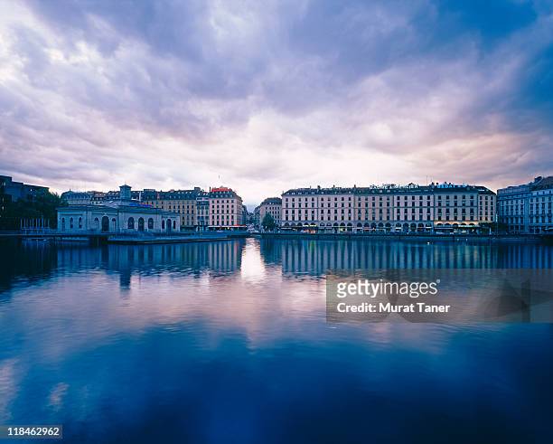 buildings reflecting into water - geneva stock pictures, royalty-free photos & images