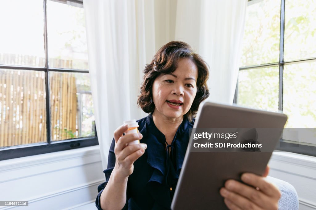Senior woman talks with a doctor online