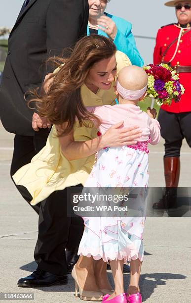 Catherine, Duchess of Cambridge greets Diamond Marshall after arriving with Prince William, Duke of Cambridge at Calgary International Airport on...