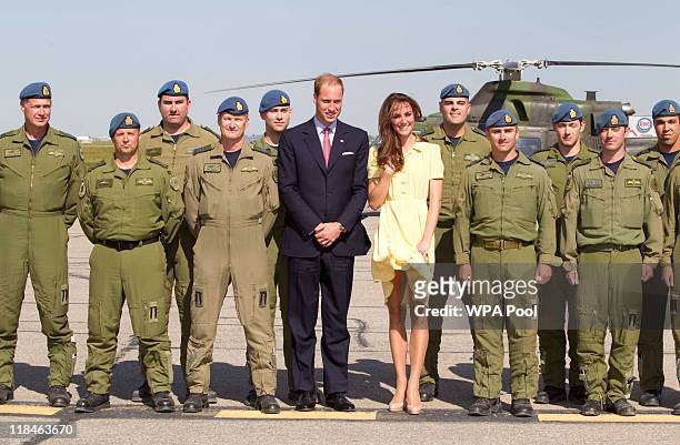 Catherine, Duchess of Cambridge and Prince William, Duke of Cambridge pose for a photo with members of the Canadian Forces flight crew after arriving...