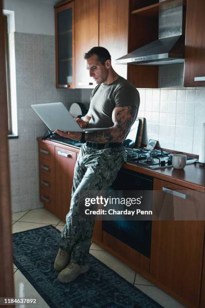 home is never far with wireless technology - handsome military men stock pictures, royalty-free photos & images