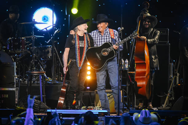 Willie Nelson and George Strait perform during "Willie: Life And Songs Of An American Outlaw" at Bridgestone Arena on January 12, 2019 in Nashville,...