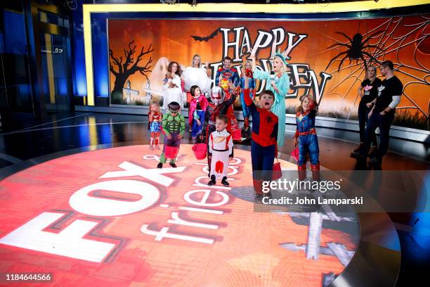 Fox anchors Jedediah Bila, Carley Shimkus, Pete Hegseth, Jennifer Rauchet, Janice Dean and children participate in "Fox & Friends" Halloween...
