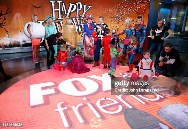 Fox anchors Carley Shimkus, Janice Dean, Ainsley Earhardt, Steve Doocy, Ed Henry, Pete Hegseth, Jennifer Rauchet and children participate in "Fox &...