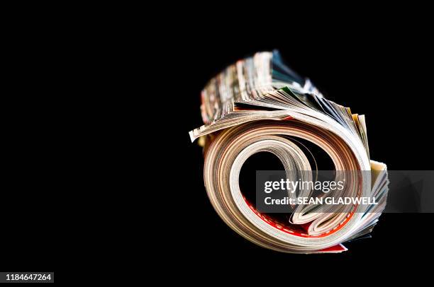 Magazine Roled Rolled Magazine Photos and Premium High Res Pictures - Getty Images