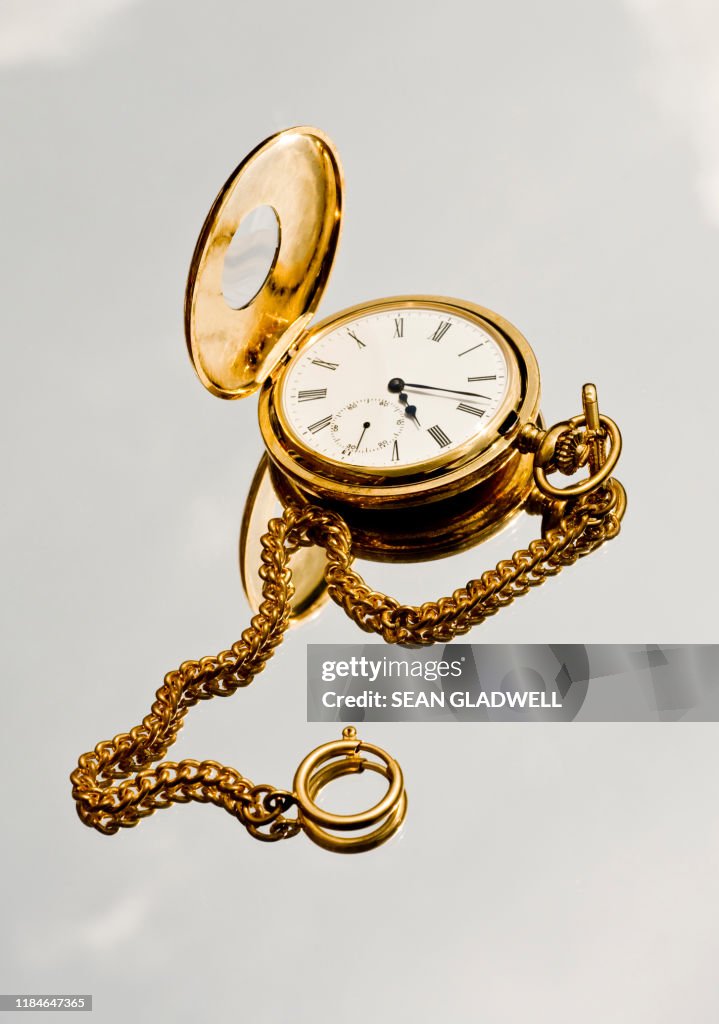 Gold pocket watch and chain
