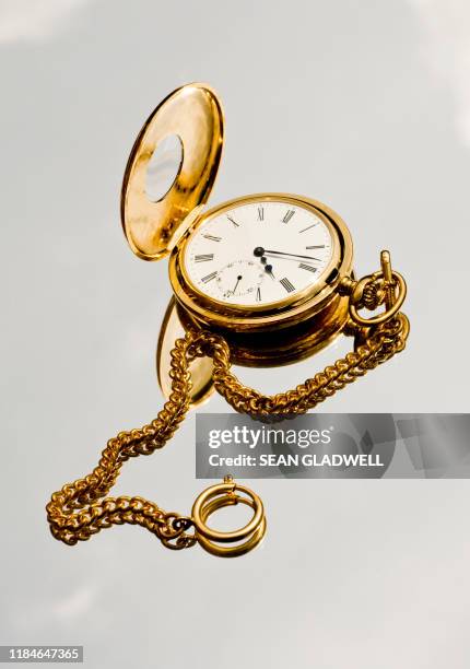 gold pocket watch and chain - antique watch stock pictures, royalty-free photos & images