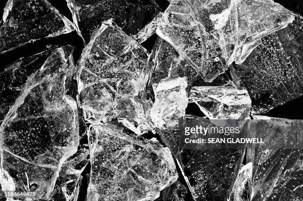 close up of broken ice - 氷　塊 ストックフォトと画像