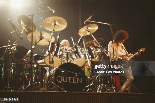Drummer Roger Taylor and guitarist Brian May of British rock group Queen in concert, 1984.