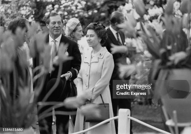 Queen Elizabeth II and Prince Philip, Duke of Edinburgh visit the Chelsea Flower Show in London, England, 1973.