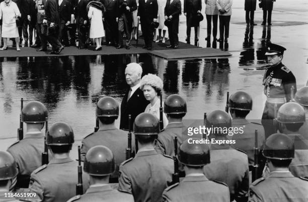 Queen Elizabeth II is met by West German President Heinrich Lubke at Cologne airport, during her tour of West Germany, May 1965.