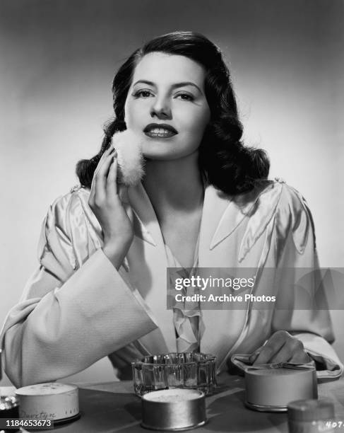 American actress and dancer Cyd Charisse applying her make-up, circa 1947. She is starring in the MGM musical film 'Fiesta'.