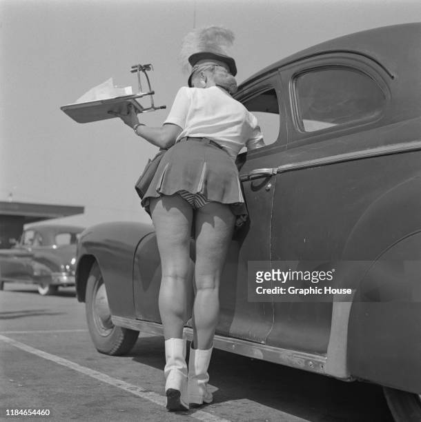 Waitress or carhop at The Clock Drive-In restaurant in California, USA, circa 1955.