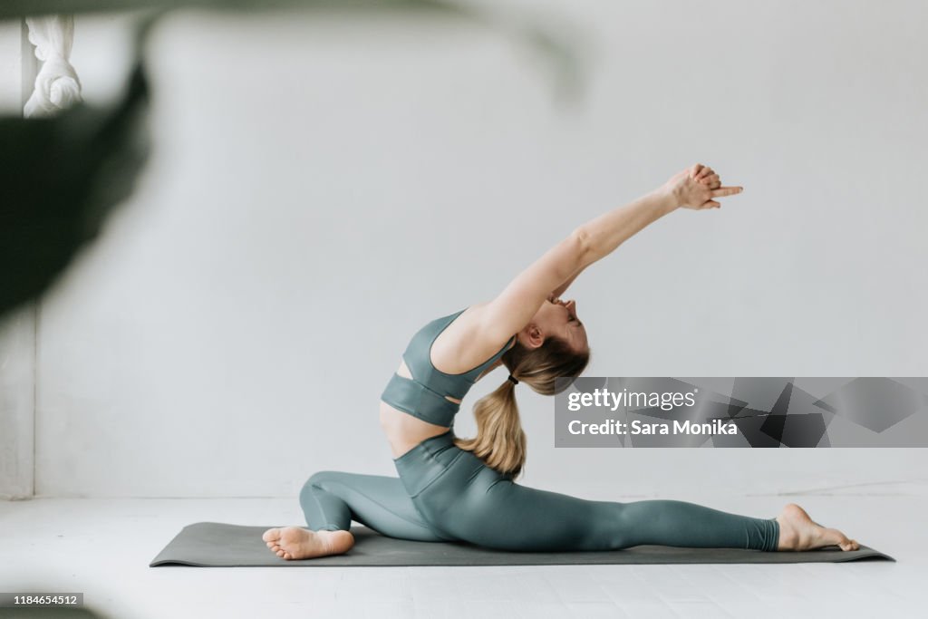 Woman practising yoga in studio