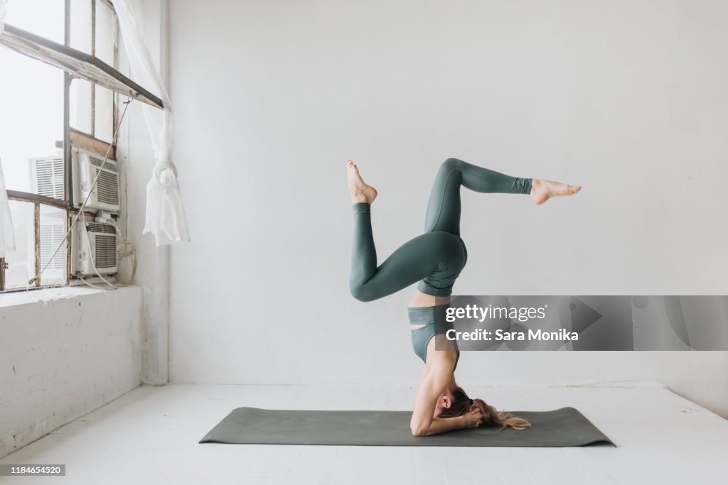 Woman practising yoga in studio