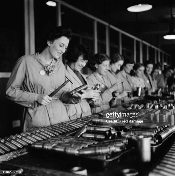 Women working in a munitions factory in Birmingham, England, during World War II, August 1941. From a Ministry of Information special on Birmingham.