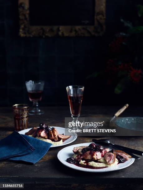 roast duck with celeriac puree cherry and pinot sauce - jantar romantico imagens e fotografias de stock