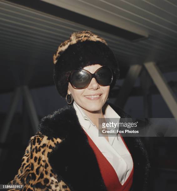 Polish-British actress Ingrid Pitt wearing a leopard coat at London Airport, England, November 1973.