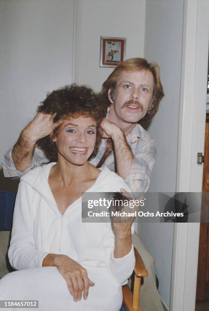 American actress Valerie Harper having her hair done, circa 1985.