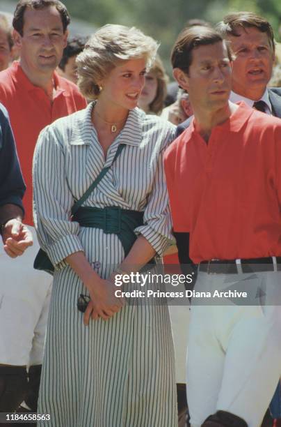 Prince Charles and Diana, Princess of Wales during a polo match at Werribee Park in Victoria, Australia, November 1985. Diana is wearing a necklace...