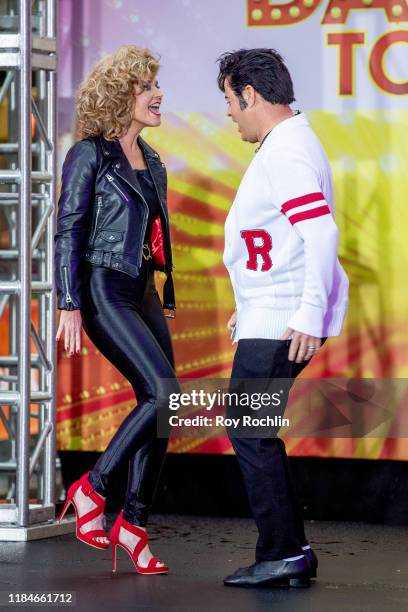 Hosts Savannah Guthrie and Carson Daly dressed as Sandy Olsson and Danny Zuko of "Grease" during NBC's "Today" Halloween Celebration at Rockefeller...