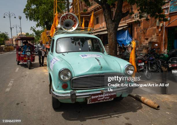 Old green car with a loudspeaker on the roof, Rajasthan, Jaipur, India on July 12, 2019 in Jaipur, India.