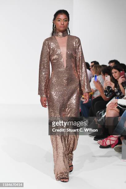 Model walks the runway at the Thym show during the FFWD October Edition 2019 at the Dubai Design District on October 31, 2019 in Dubai, United Arab...