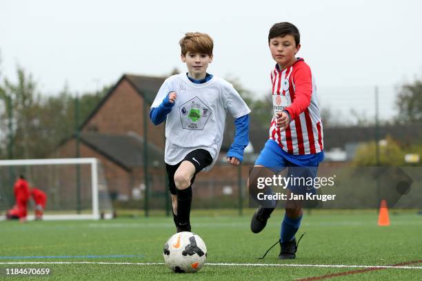 Local children take part in activities during a Premier League Football Foundation Hub Opening at Jericho Lane Playing Fields on October 31, 2019 in...