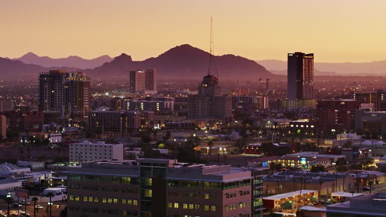 https://media.gettyimages.com/id/1184672358/video/aerial-establishing-shot-of-downtown-phoenix-at-sunrise.jpg?b=1&s=640x640&k=20&c=9IwYPmGvsgYkkLYAh1WJReu4gM6a_SS8U3GfgZXyBuQ=