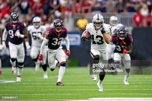 Hunter Renfrow of the Oakland Raiders runs the ball for a touchdown during a game against the Houston Texans at NRG Stadium on October 27, 2019 in...