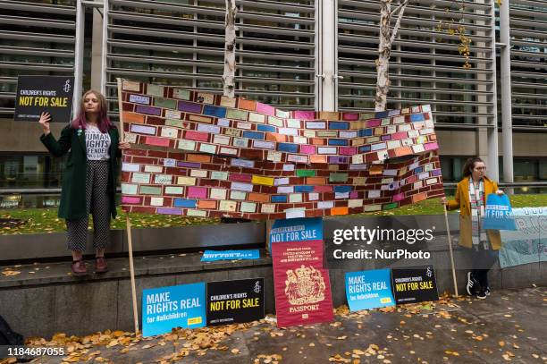 Amnesty International activists gather at the UK Home Office to demonstrate and deliver a petition demanding to stop profiteering from children's...