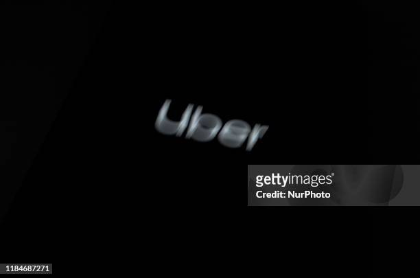 Uber Technologies Inc. App is seen on a smartphone in London, November 25, 2019. Uber lost its license in London for the second time in less than...