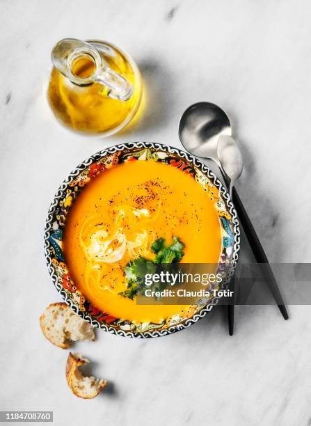 bowl of squash soup on white background - homemade soup stock pictures, royalty-free photos & images