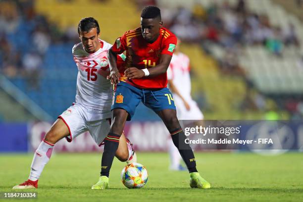 Sunatullo Ismoilov of Tajikistan defends Moriba Ilaix of Spain during the FIFA U-17 World Cup Brazil 2019 group E match between Spain and Tajikistan...