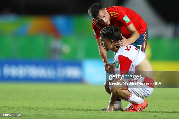 Alejandro Blesa of Spain comforts Nidoyor Zabirov of Tajikistan after Spain defeat Tajikistan 5-1 during the FIFA U-17 World Cup Brazil 2019 group E...