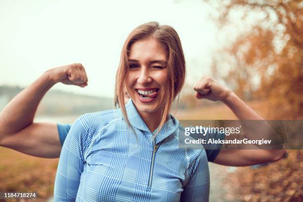 cute female and her muscular boyfriend - cute girlfriends stock pictures, royalty-free photos & images