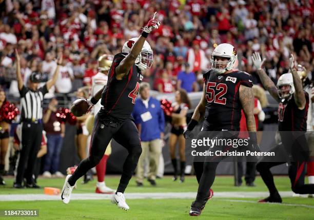 Running Back Kenyan Drake of the Arizona Cardinals and teammates celebrate his touchdown in the first quarter over the San Francisco 49ers at State...