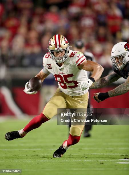Tight end George Kittle of the San Francisco 49ers completes a reception in the first quarter over the Arizona Cardinals at State Farm Stadium on...